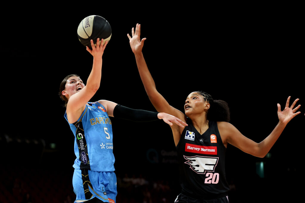 Jade Melbourne scores a layup against the Flames