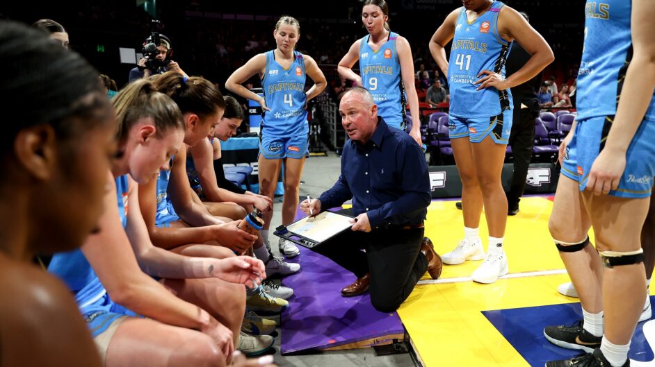 UC Caps huddle against the Sydney Flames